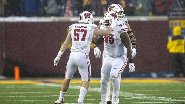 Jack Sanborn celebrating with Keeanu Benton. (Credit: Jesse Johnson-USA TODAY Sports)